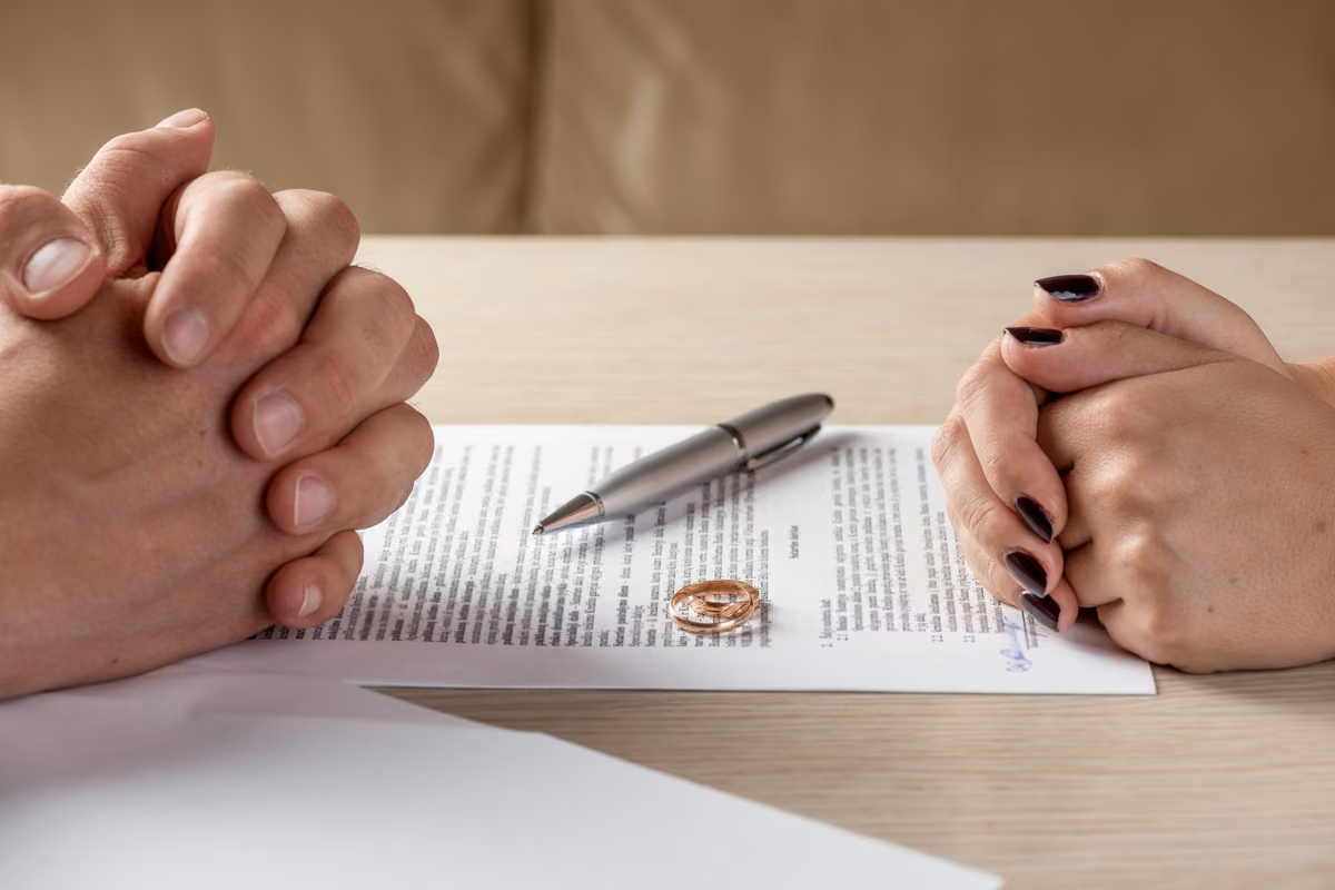 Person reviewing and updating their life insurance policy after a divorce