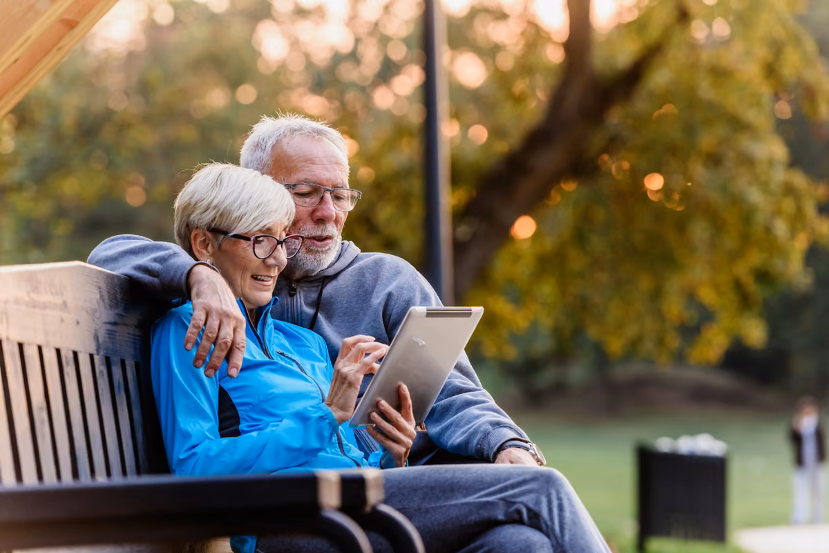 Senior couple reviewing their life insurance options together at home