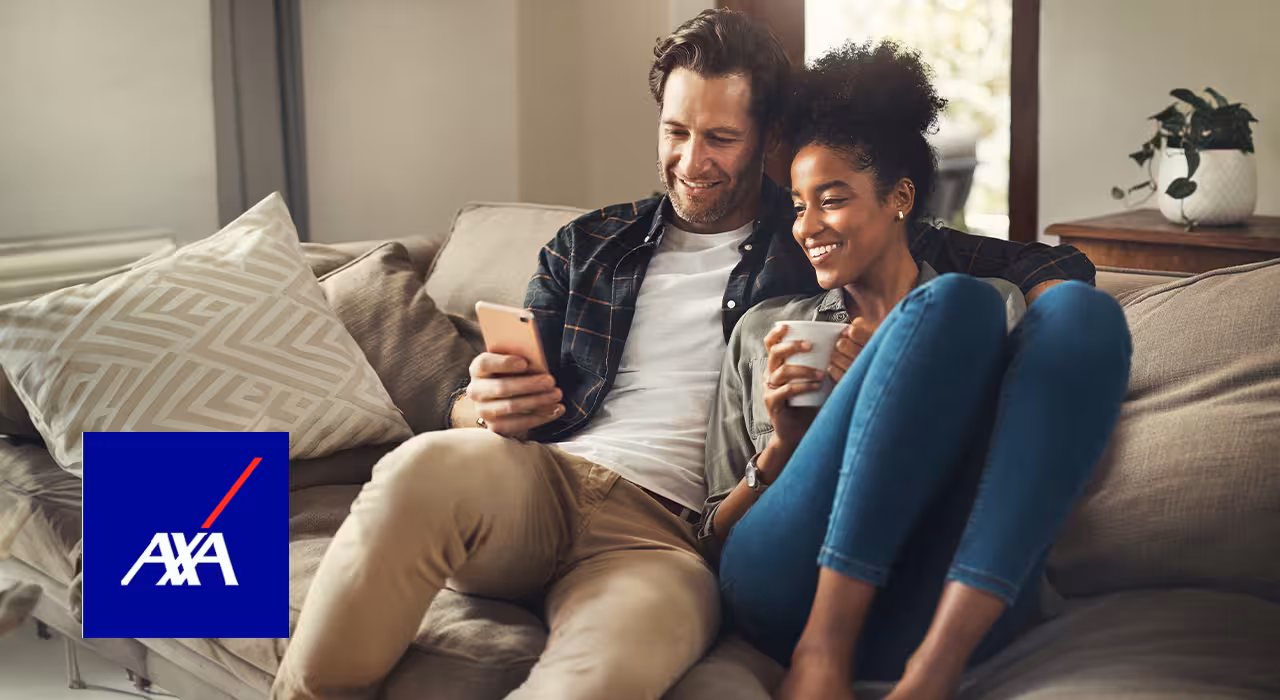 Couple relaxing on a sofa at home, looking at a phone together and smiling, with the myTribe Insurance Experts logo and AXA logo overlaid
