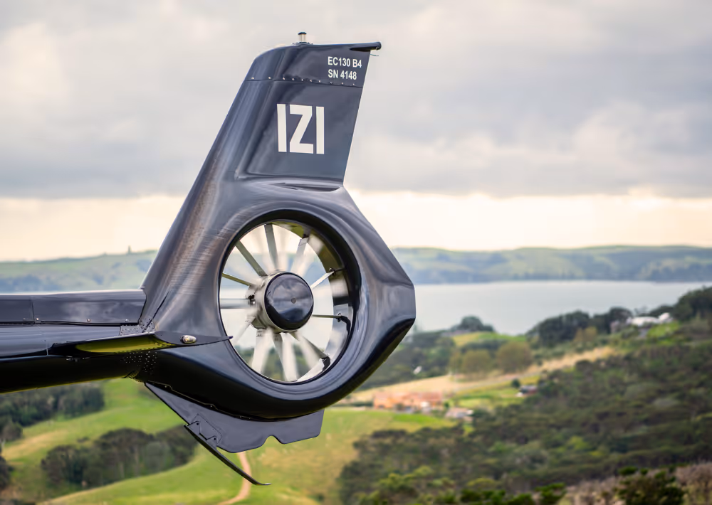 A helicopter with the ocean view in the background