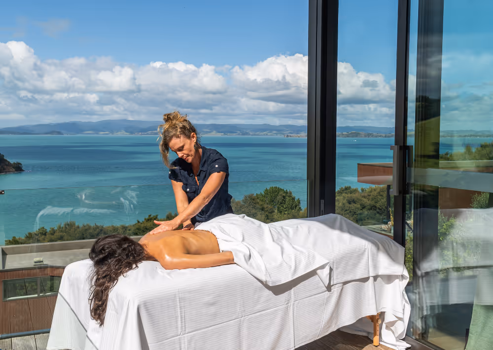 A guest gets a massage on the balcony
