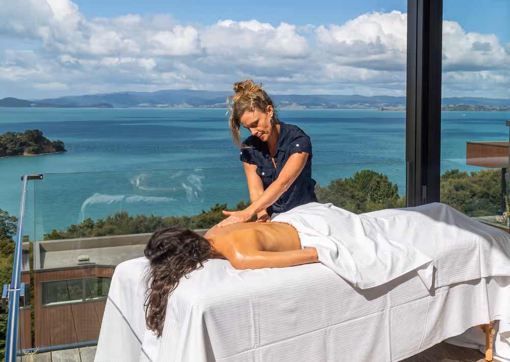 A woman getting a massage on Villa Serenity's balcony