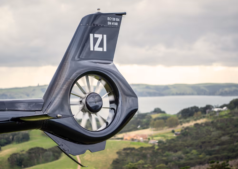 A helicopter with Waiheke Island as the backdrop