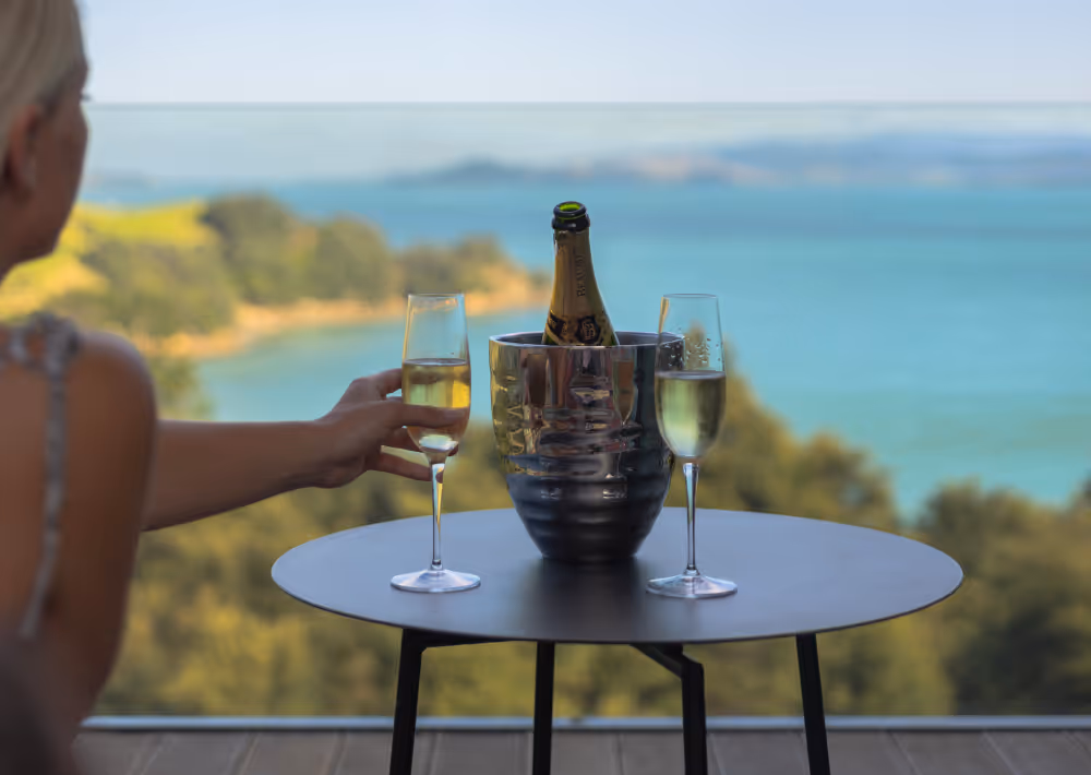A guest having wine at Villa Joy's balcony