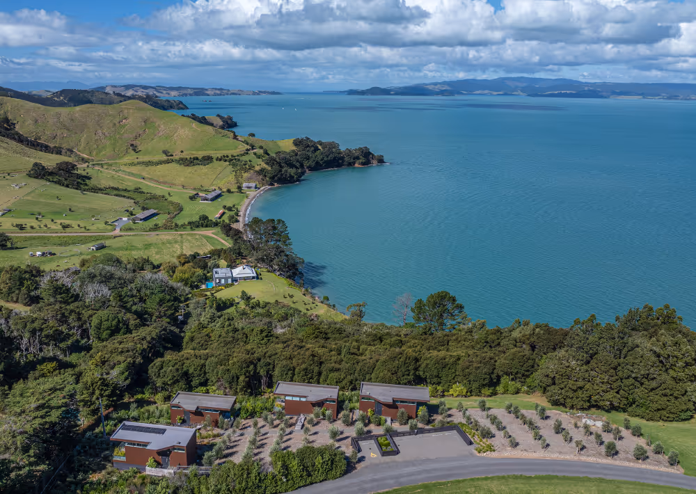 An aerial view of Omana boutique hotel surrounded by nature and the ocean