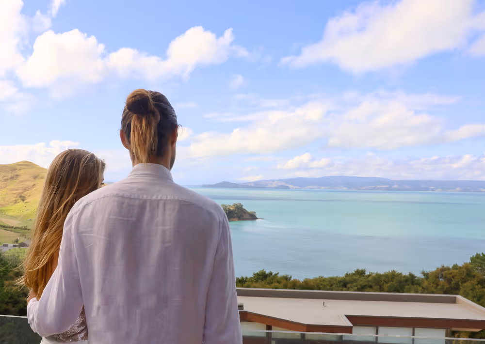 A couple marvels at the stunning view from Omana's balcony
