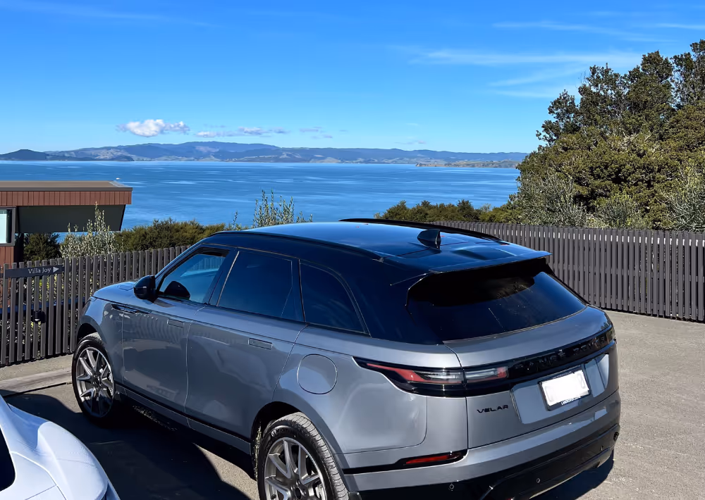 Omana's exclusive car park for guests with the ocean view in the backdrop