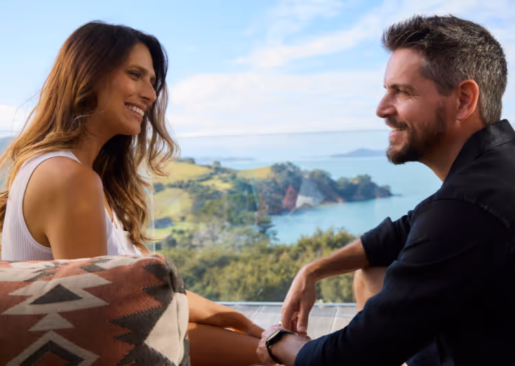A couple enjoy Villa Joy's balcony