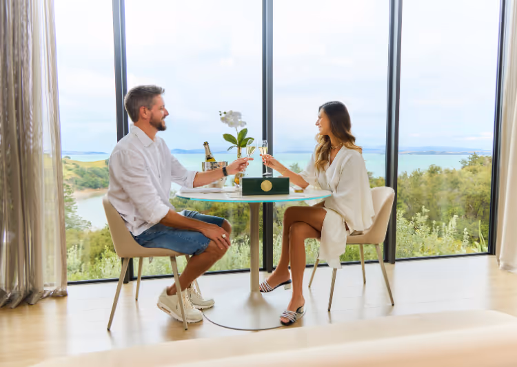 A couple enjoys sparkling wine and caviar at Omana, Waiheke Island