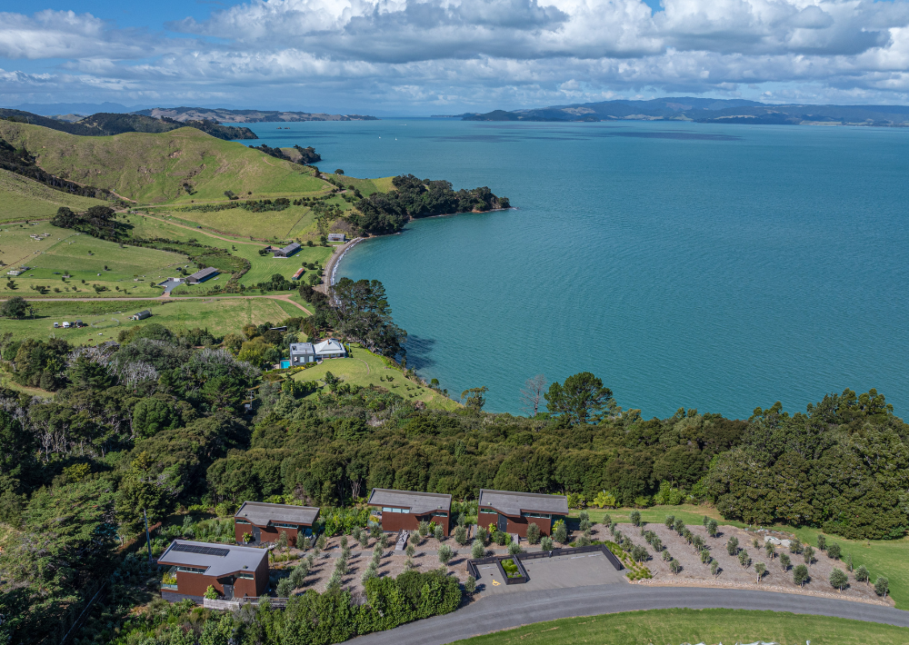 Stunning aerial view of Omana's four luxury villas immersed in nature