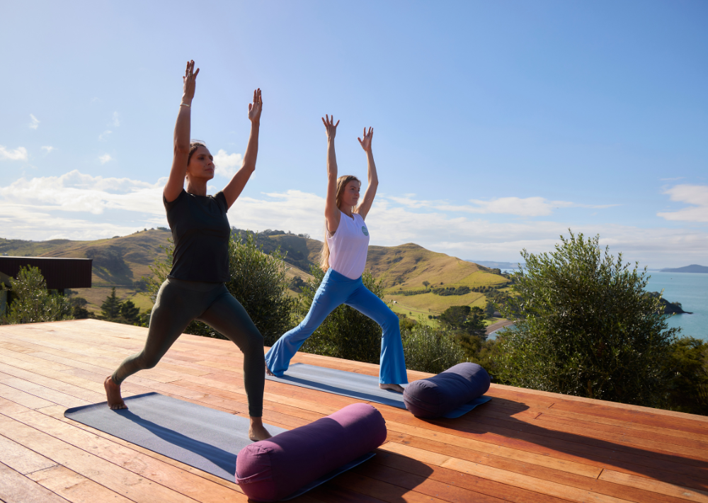 Omana guest enjoys  yoga session with the ocean as the backdrop