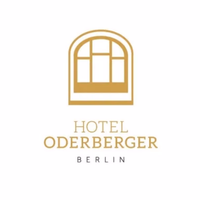 Logo with a gold arched window above the text Hotel Oderberger Berlin.