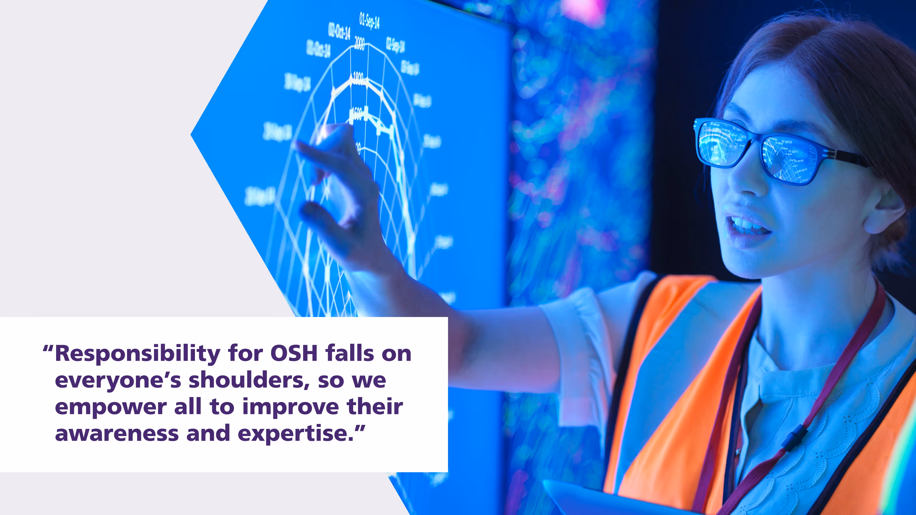 Woman In Safety Vest Interacting With Interactive Display