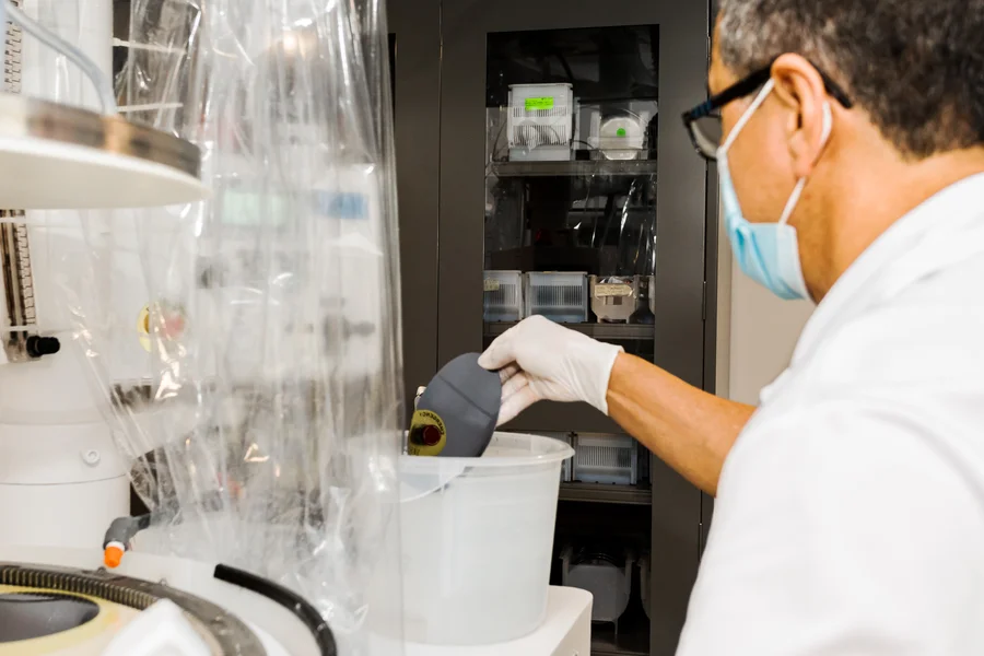 silicon-wafer-processing-cleanroom-technician-inspecting-semiconductor-wafer