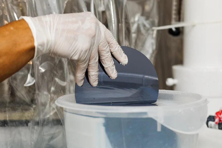 silicon-wafer-processing-technician-rinsing-semiconductor-wafer