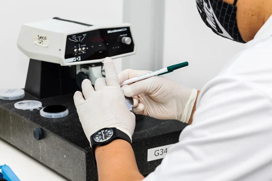 thin-silicon-wafers-technician-measuring-wafer-thickness