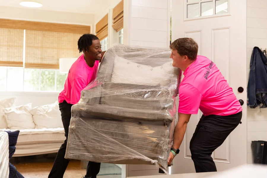 professional-movers-carrying-wrapped-furniture-mobile-alabama