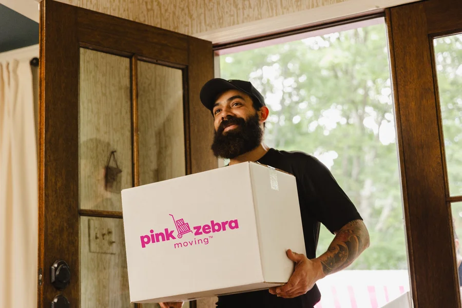 professional-mover-carrying-moving-box-into-home-salt-lake-city