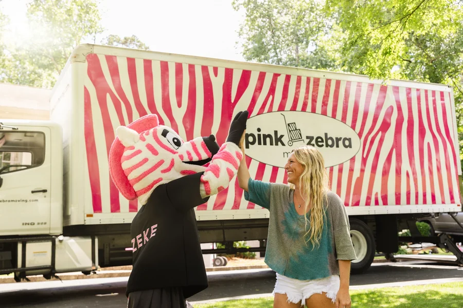 pink-zebra-mascot-high-fiving-customer-nashville-tn