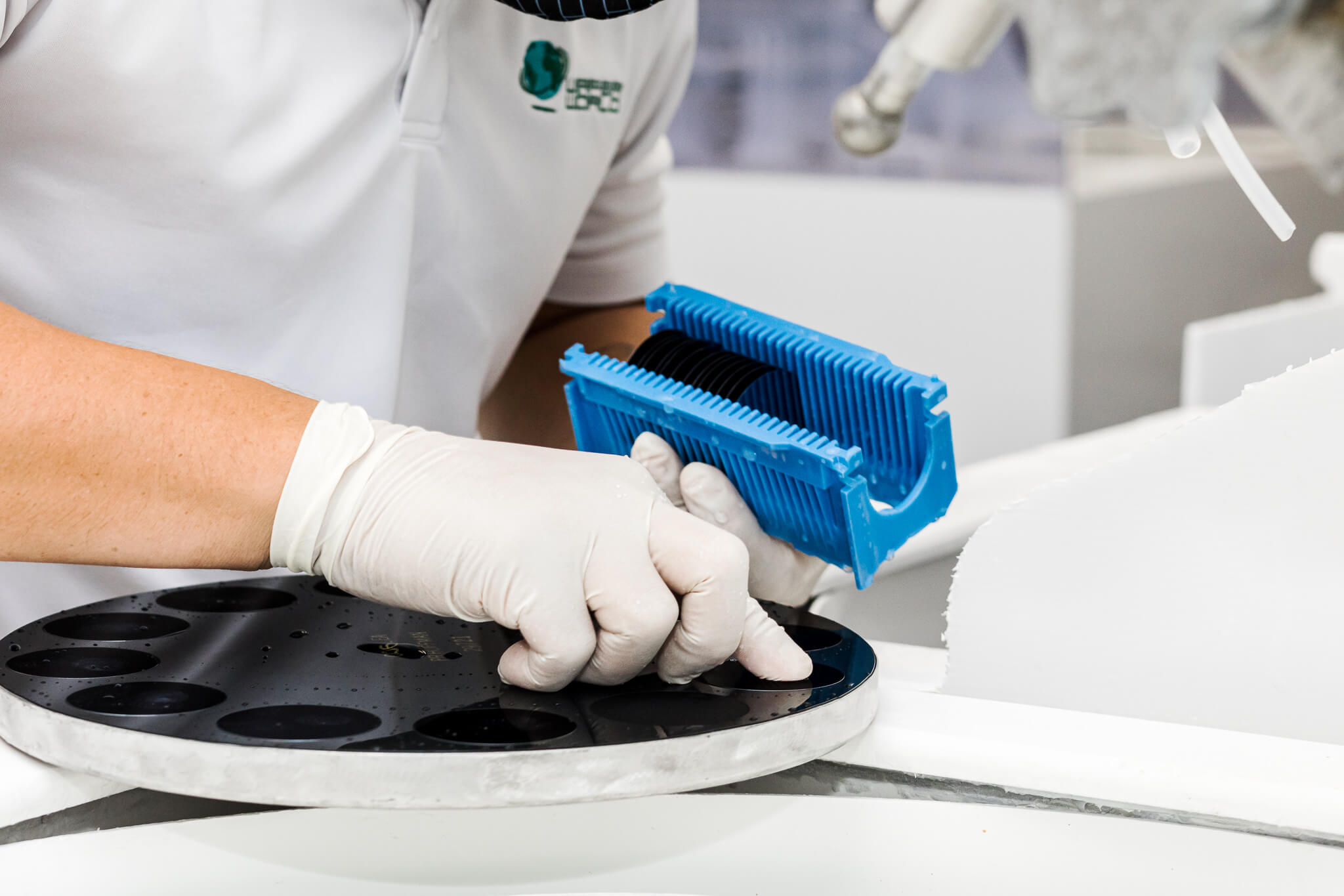 a male working polishing Ultra flat wafers