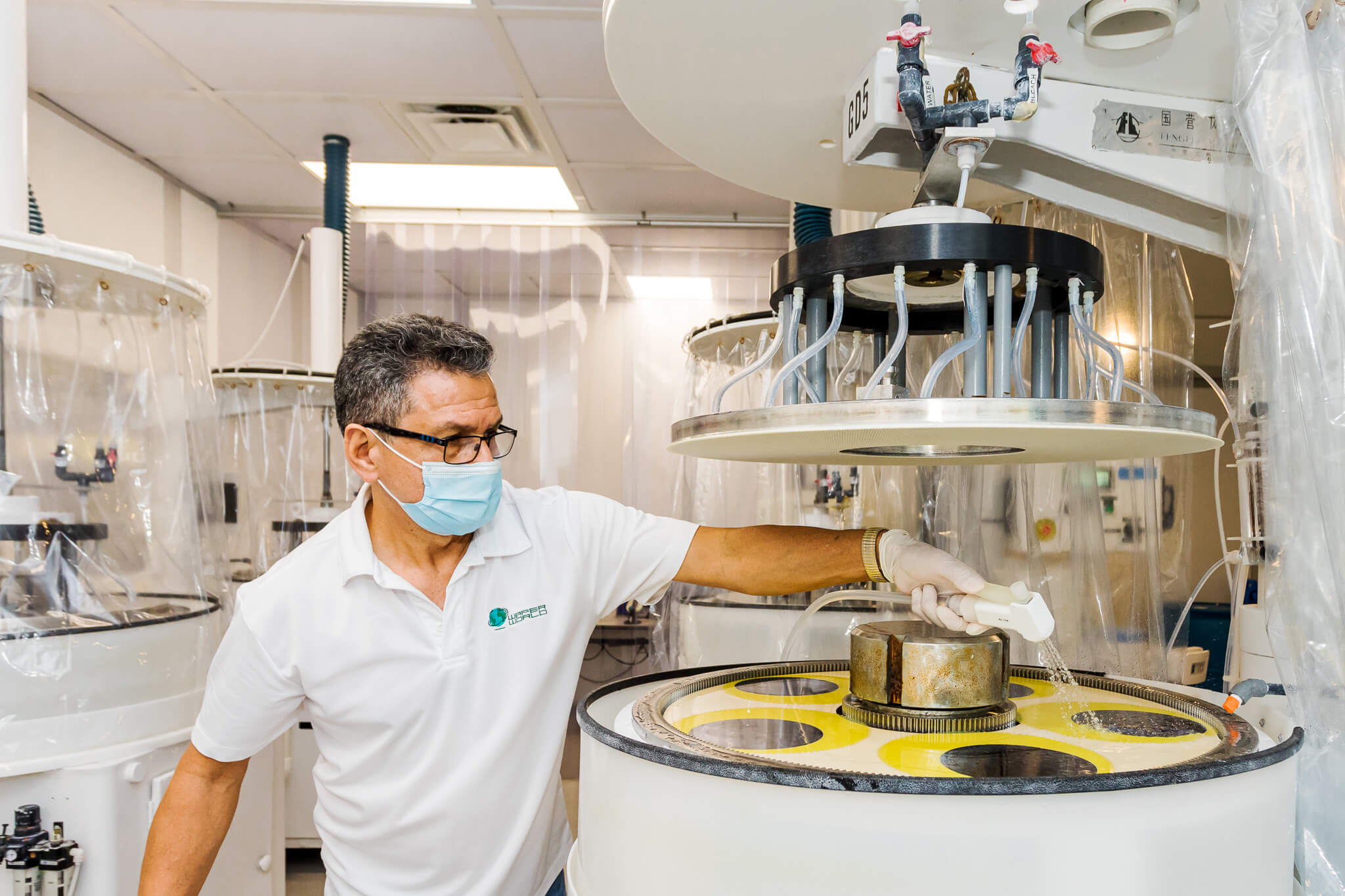 a worker processing a Germanium Wafer