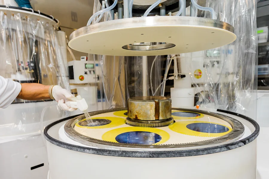 technician-loading-germanium-wafer-polishing-machine