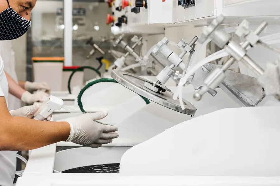 technician-rinsing-wafer-silicon-manufacturing-cleanroom