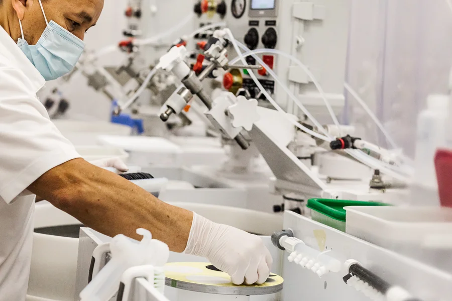worker-operating-equipment-silicon-manufacturing-line