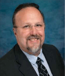 Headshot of Chuck Travis,