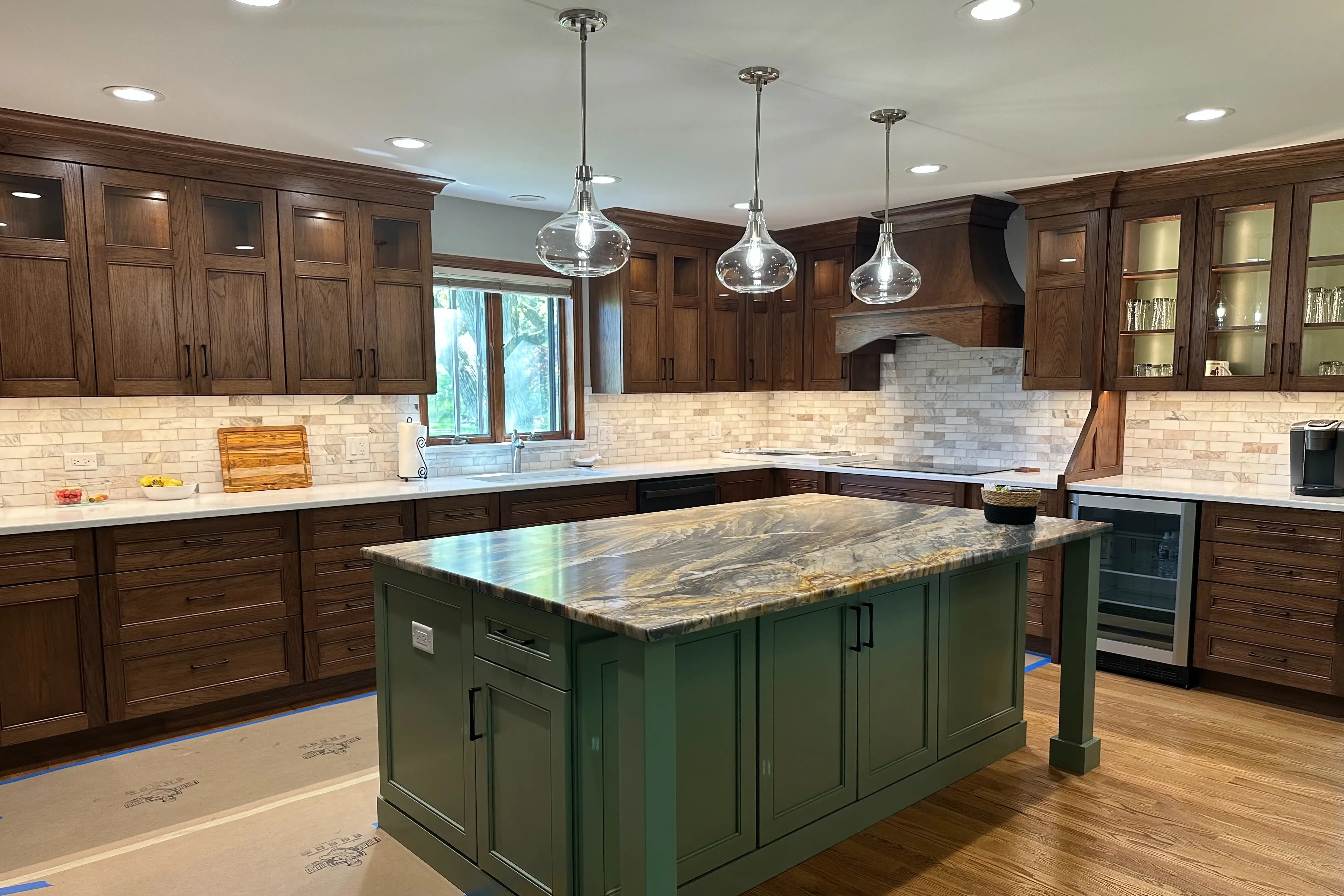 a kitchen with a green island