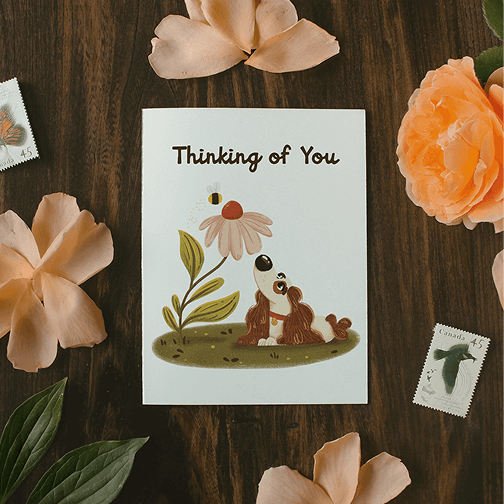 Thinking of You Dog greeting card surrounded by flowers