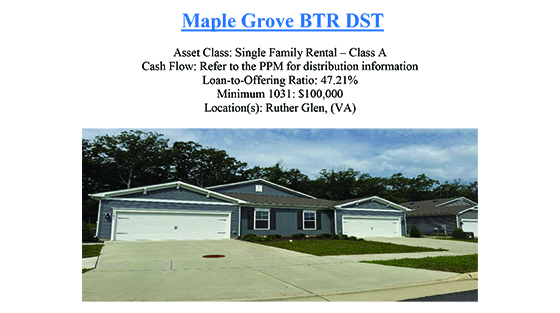 Two single-story suburban houses with gray siding and attached garages under a partly cloudy sky.