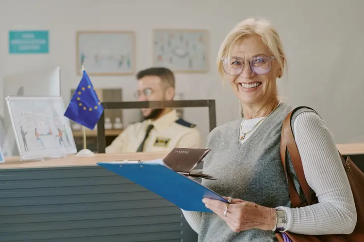 senior woman passport eu immigration desk