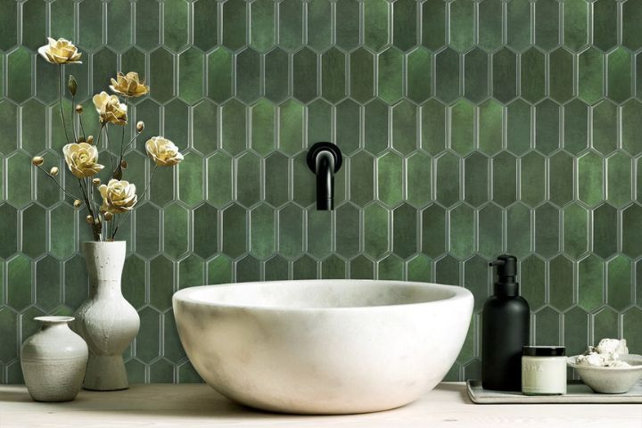 Colleagues enjoying drinks at their holiday plans at their office Christmas party and discussing tax deductible