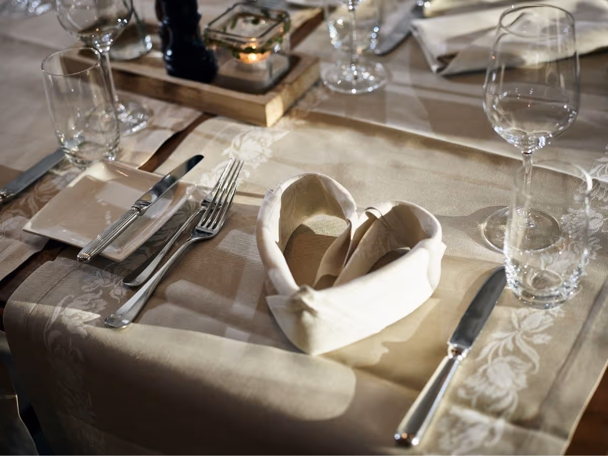 Napkin folded as a heart on a set table