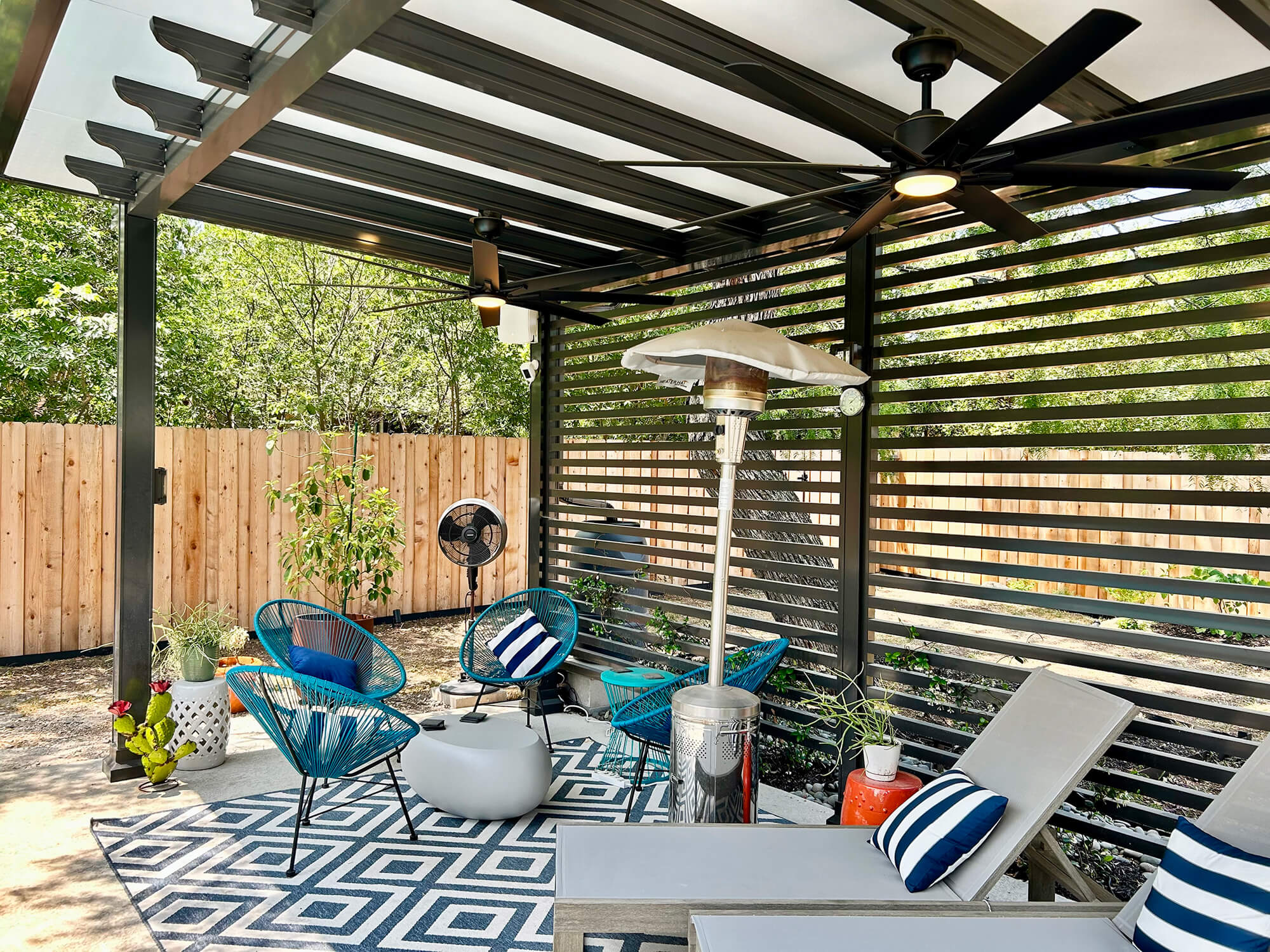 Outdoor pergola with modern furniture and decor.