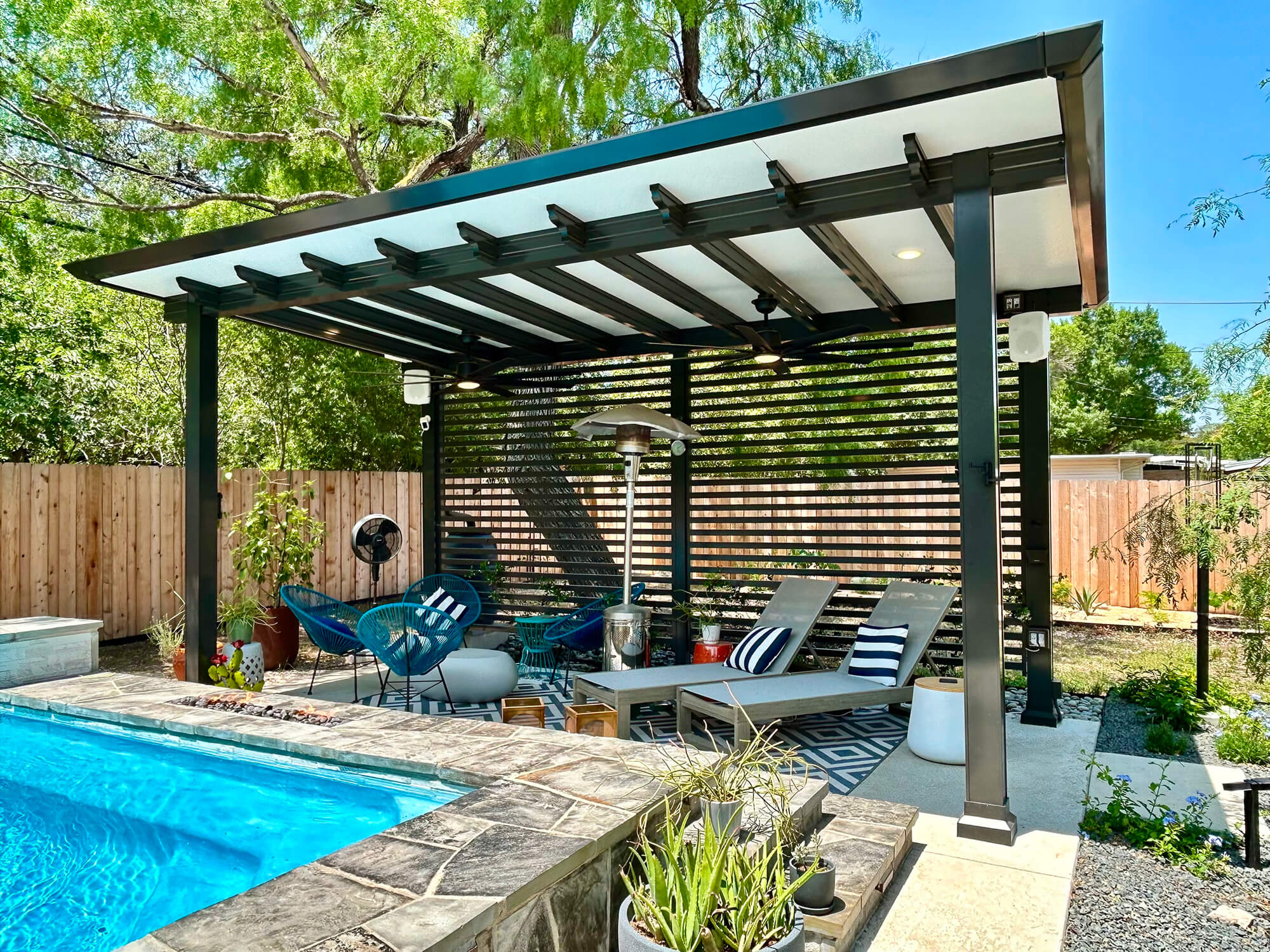 Modern pergola over poolside lounge area