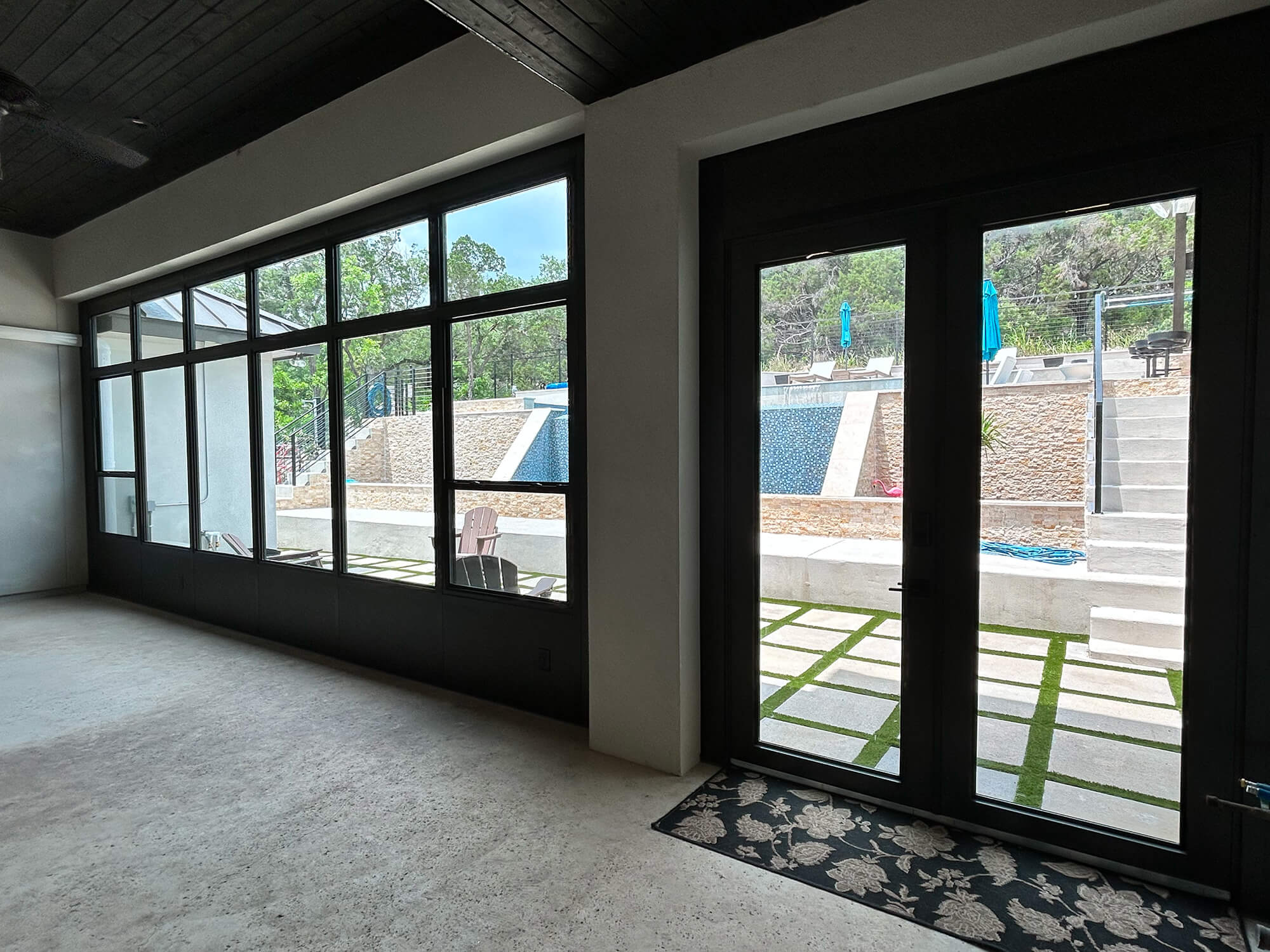 Modern patio enclosure with pool view