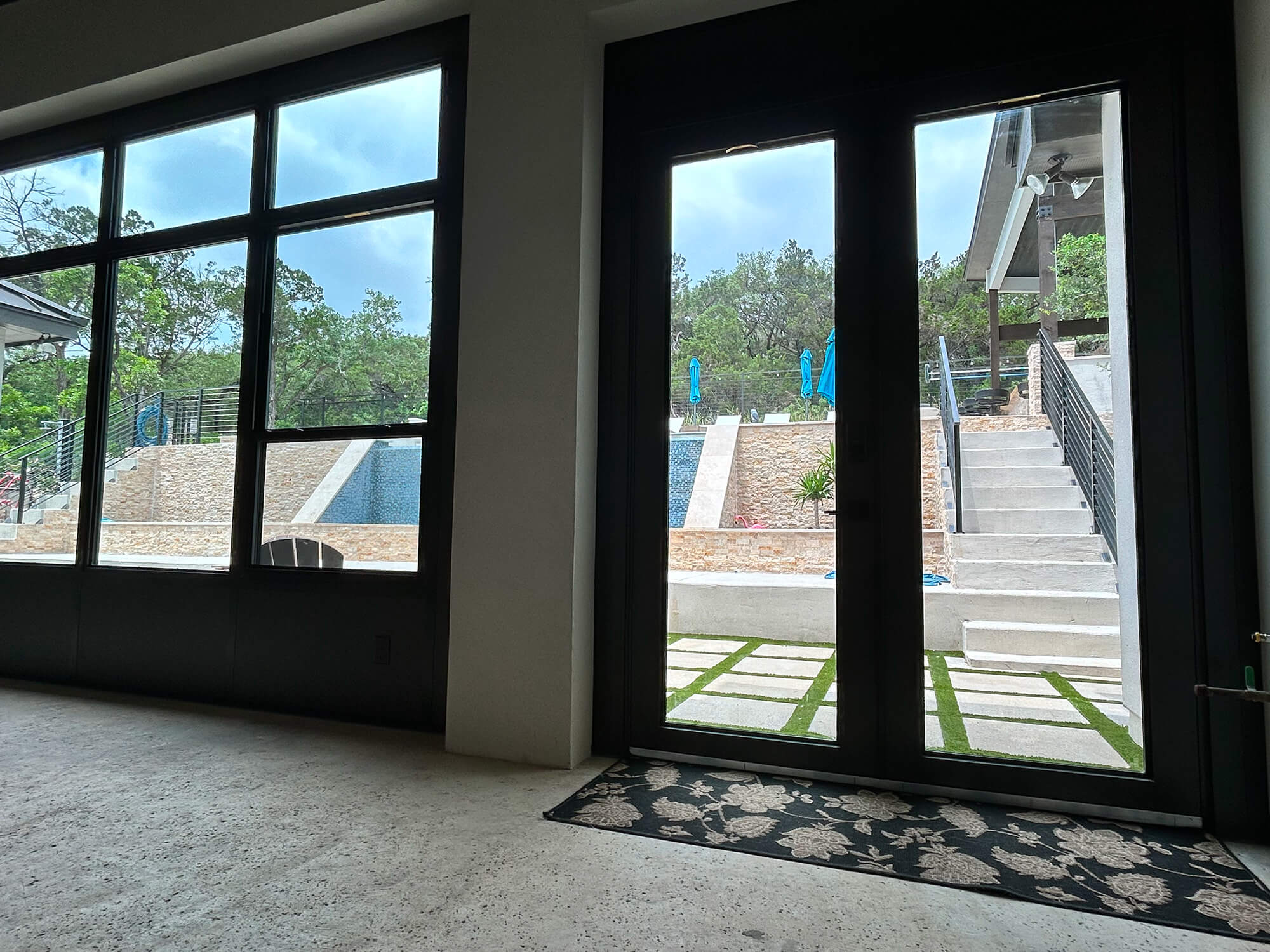 Outdoor patio view with steps and trees