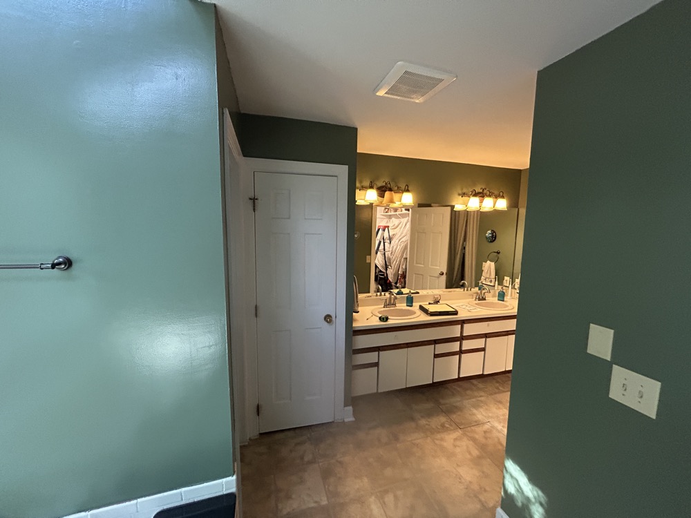 Below is the same view (while standing in the tub) as the view above. We removed the walls around shower (left side) and pushed back the green (closet) wall on right side so the new vanity location exactly fit to the wall. Part of this renovation was the create matching his/her walk in closets and center the access hallway. We did that by relocating the vanity area to be near the tub. This created more space for the closets and allowed us to shift over the hallway to the left and center it's entrance on the master bedroom wall.