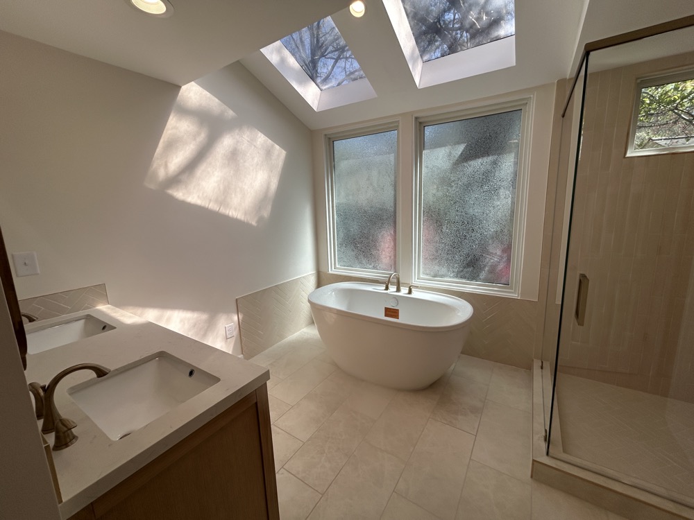The new free standing tub and full glass shower enclosure.