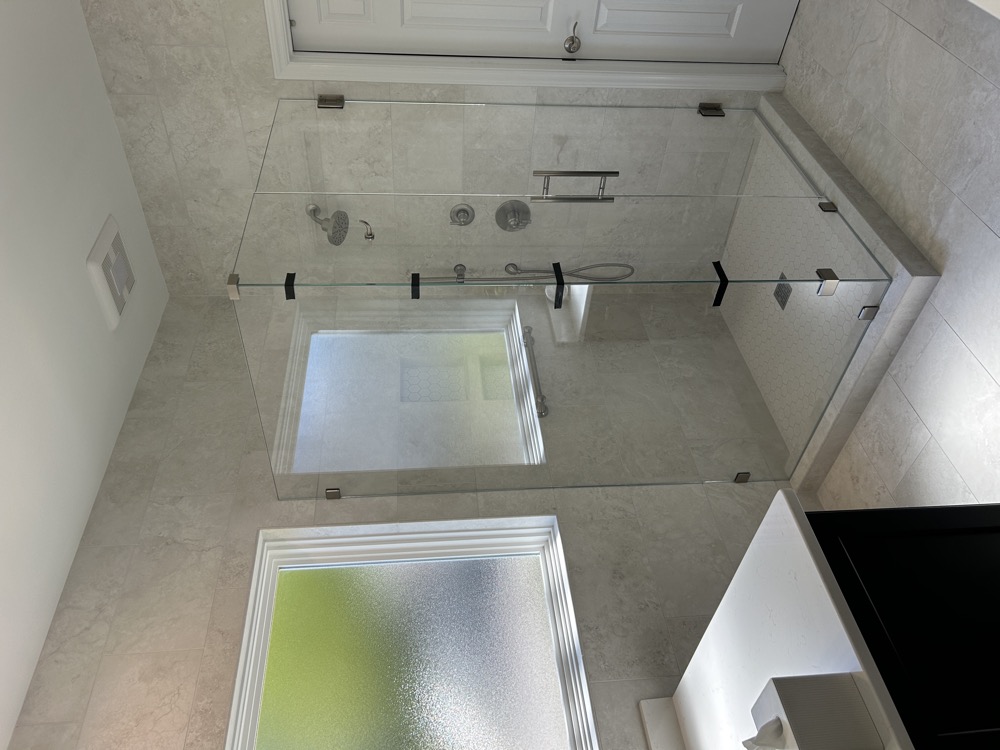 The new shower did not change its location but it did expand in size.