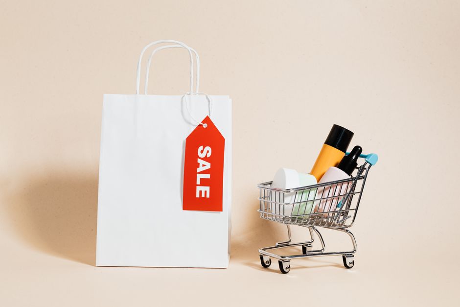 White bag with sale tag and mini cart