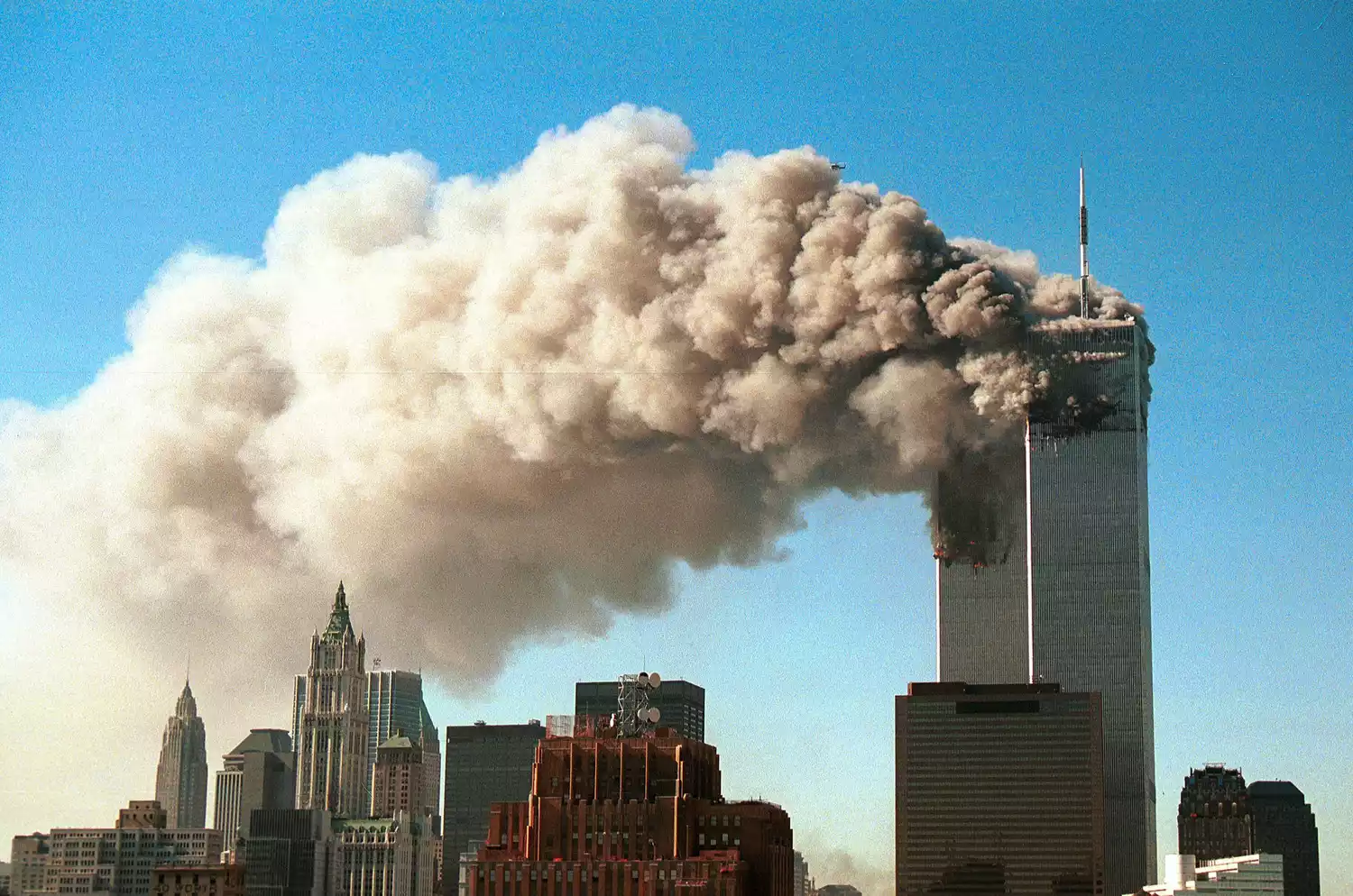 Smoke pours from the twin tower skyscrapers after being hit by two hijacked airliners in a terrorist attack September 11, 2001 in New York City