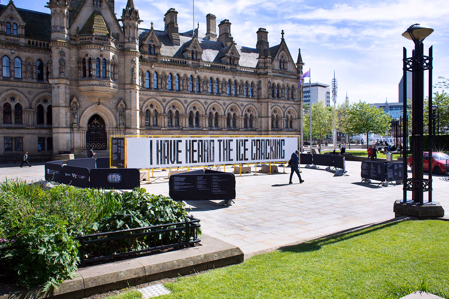 Large mural in Bradford's Centenary Square which reads, 'I Have Heard the Ice Cracking'