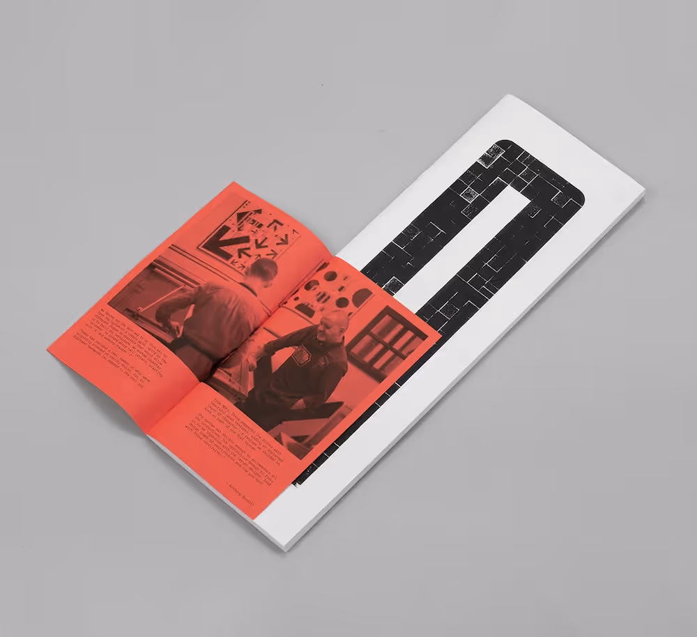 Photograph of the Brico book, featuring letters designed by Oli Bentley, Anthony Burrill and Thomas Mayo