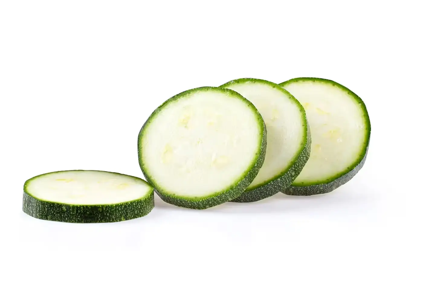 BenchFoods 3 mm slicer blade (1/8 inch) slicing zucchini into consistent thin vegetable rounds