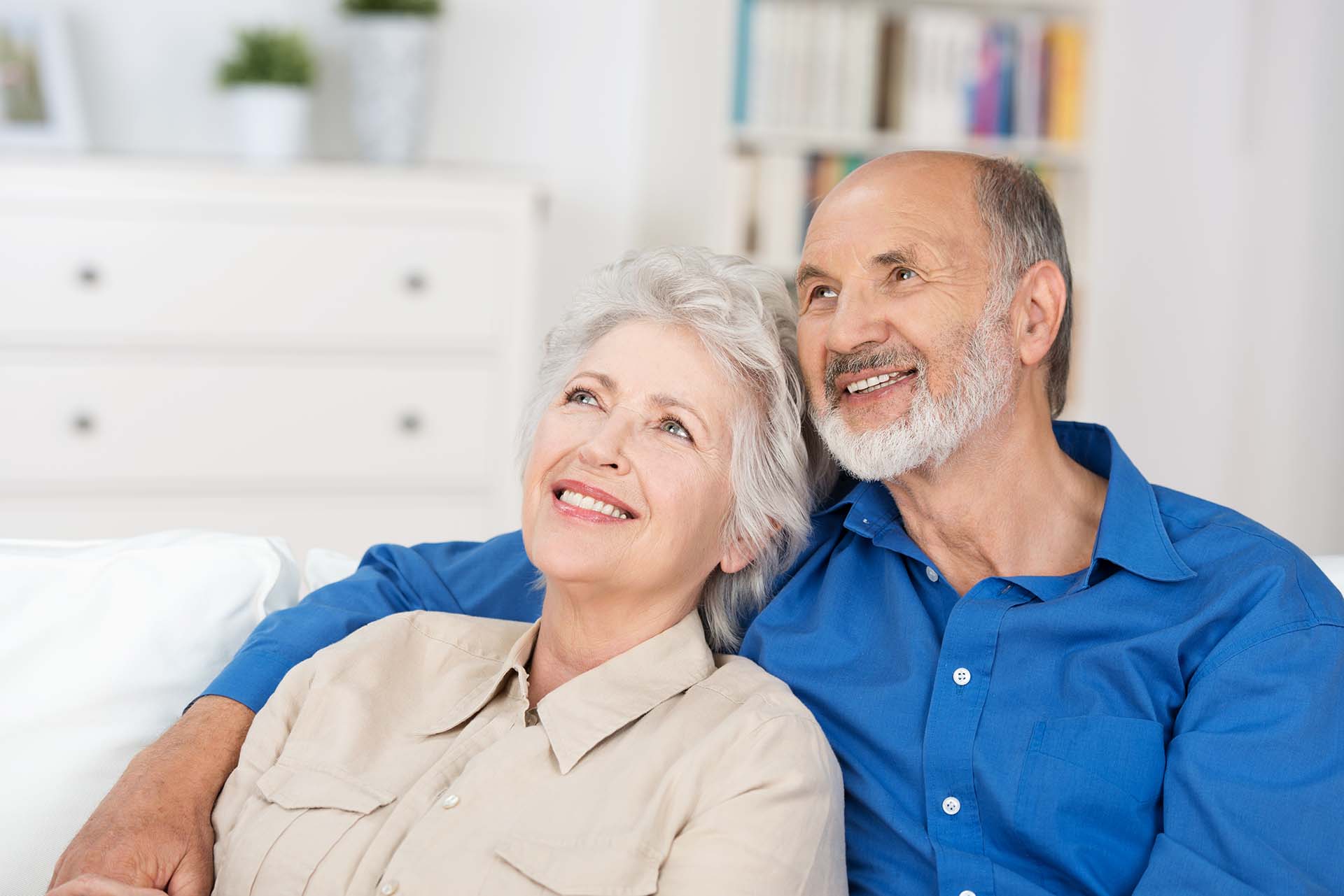 Elderly couple smiling while thinking about their annuities in West Detroit. 