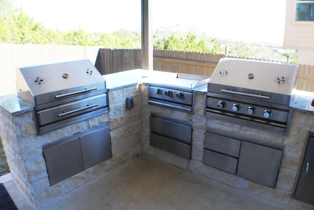 Outdoor kitchen with stainless steel grills