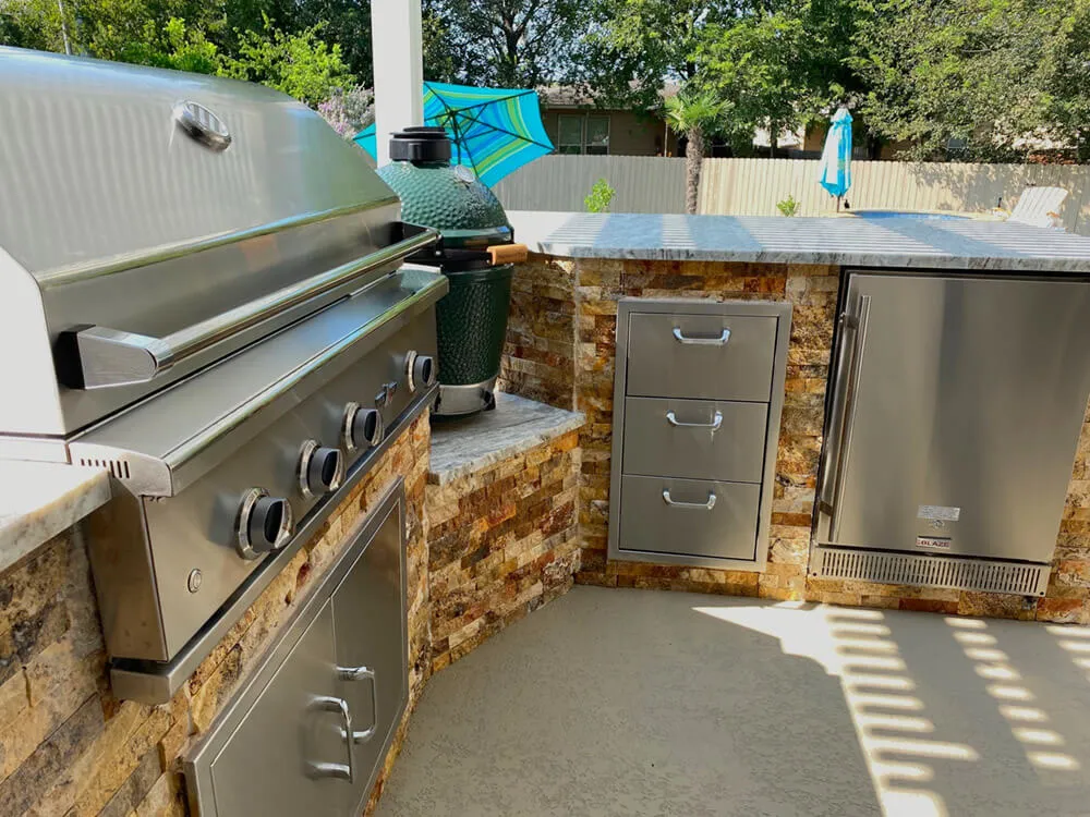 stainless steel appliances adjacent beige cabentry